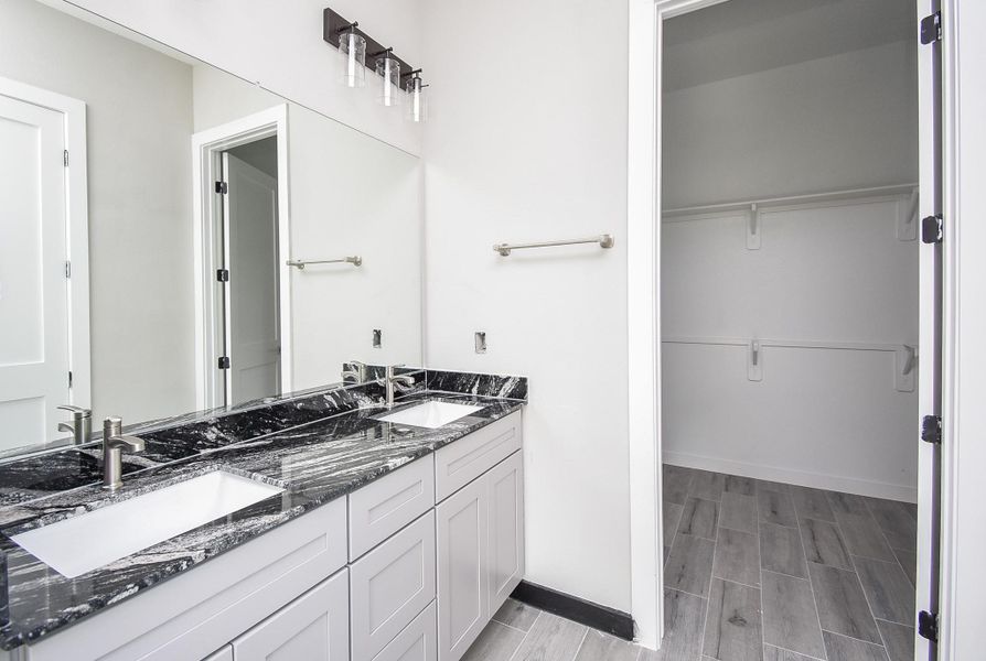 Granite Counter and double sinks in the Primary Bathroom