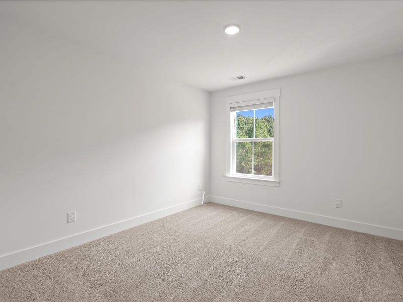 Spacious, unfurnished interior of a new home in The Coves at Lakes of Cane Bay, Summerville (Image 28). Spacious, unfurnished interior of a new home in The Coves at Lakes of Cane Bay, Summerville (Image 28).