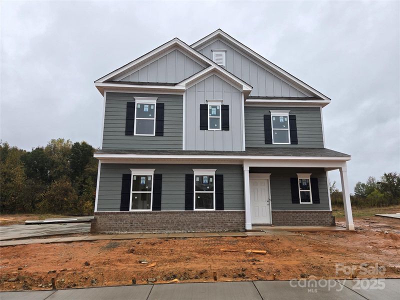 Front exterior of a new home in Cedar Meadows, Monroe, NC, highlighting curb appeal (Image 1).