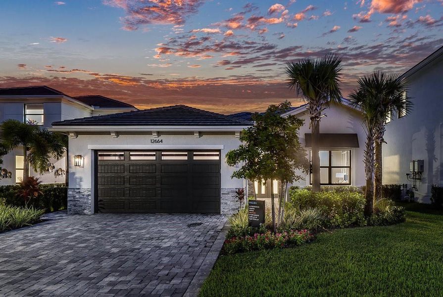 Front exterior of a new home in , Palm Beach Gardens, FL, highlighting curb appeal (Image 18). Front exterior of a new home in , Palm Beach Gardens, FL, highlighting curb appeal (Image 18).