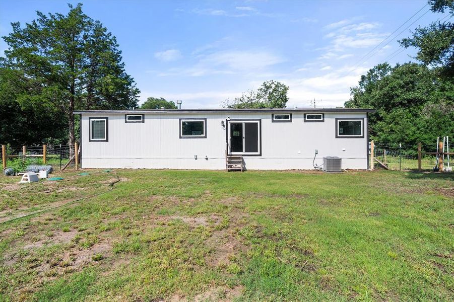 Rear view of the home. Rear view of the home.