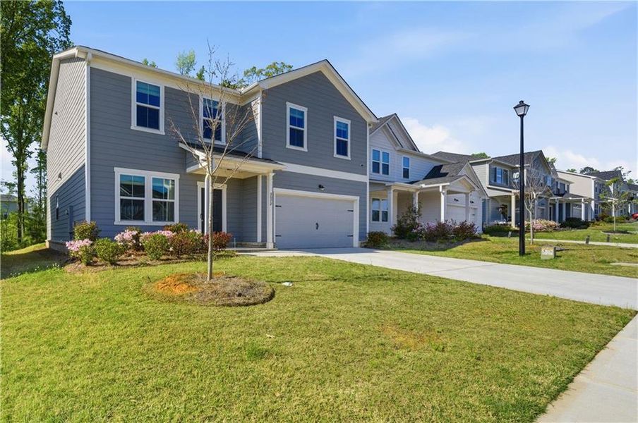 Front exterior of a new home in , Covington, GA, highlighting curb appeal (Image 2). Front exterior of a new home in , Covington, GA, highlighting curb appeal (Image 2).