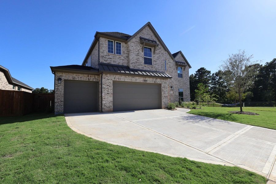 Front exterior of a new home in Clopton Farms, Montgomery, TX, highlighting curb appeal (Image 1). Front exterior of a new home in Clopton Farms, Montgomery, TX, highlighting curb appeal (Image 1).