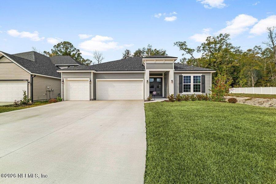 Front exterior of a new home in , Middleburg, FL, highlighting curb appeal (Image 25).