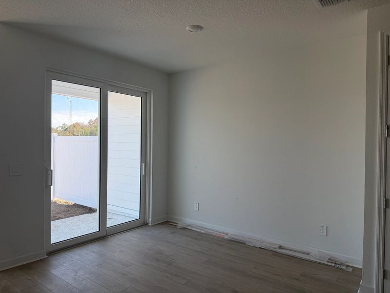 Open dining space with easy access to back patio Open dining space with easy access to back patio