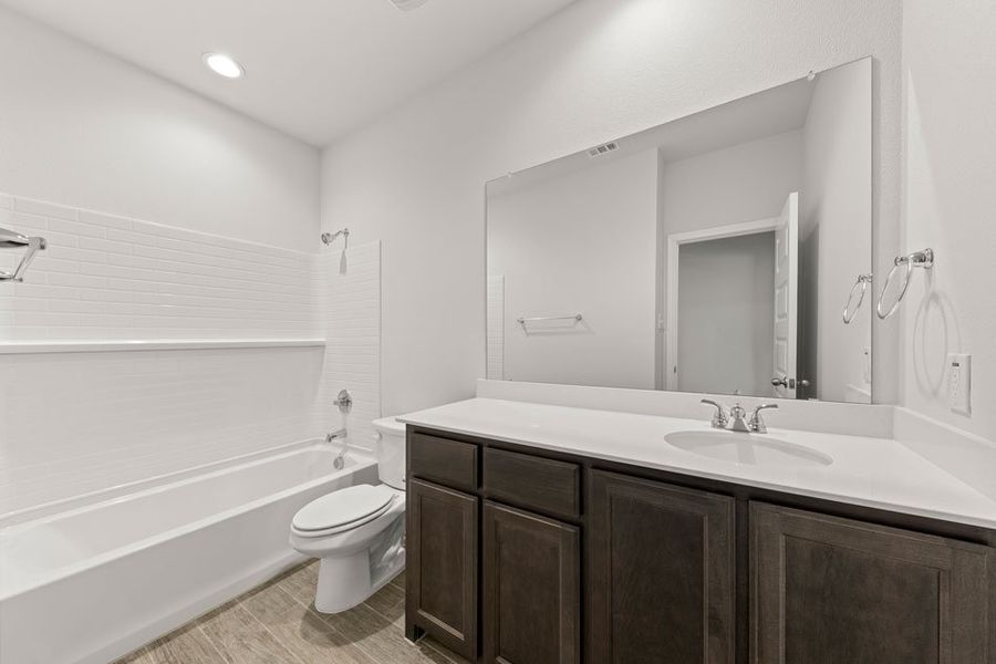 Representative exterior photo of a completed home built from the Hickory by Impression Homes in Northspur, Terrell, TX (Image 16). Representative exterior photo of a completed home built from the Hickory by Impression Homes in Northspur, Terrell, TX (Image 16).