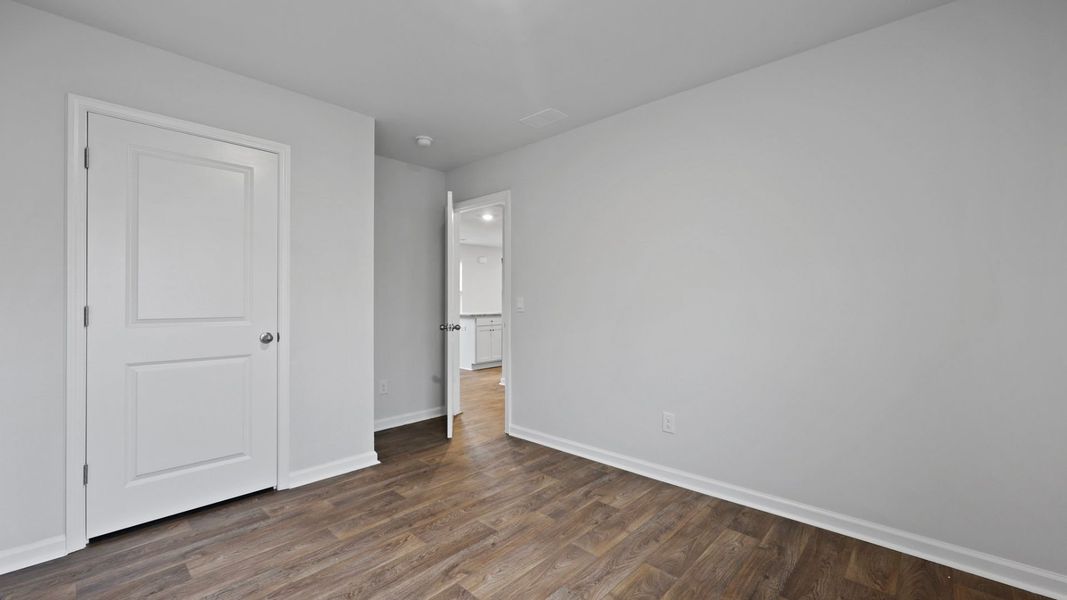 Representative unfurnished interior of a home built from the DOWNING by D.R. Horton in Saltgrass Landing, Winnabow (Image 24).