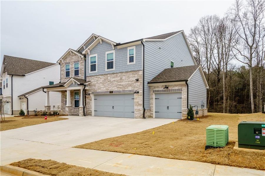 Front exterior of a new home in , Powder Springs, GA, highlighting curb appeal (Image 32). Front exterior of a new home in , Powder Springs, GA, highlighting curb appeal (Image 32).