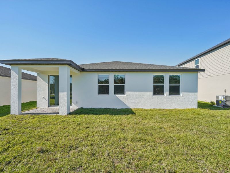 Exterior details and patio area of a home in The Reserve at Hammock Oaks - Signature Series, Lady Lake (Image 2).