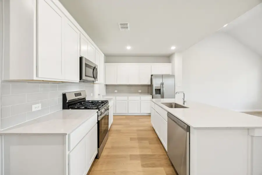 Kitchen in the Masters home plan by Trophy Signature Homes – REPRESENTATIVE PHOTO Kitchen in the Masters home plan by Trophy Signature Homes – REPRESENTATIVE PHOTO