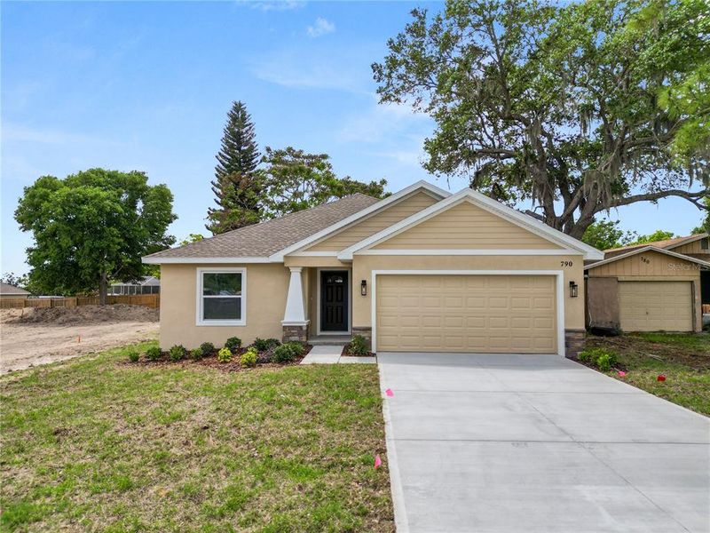 Front exterior of a new home in , Eagle Lake, FL, highlighting curb appeal (Image 23).