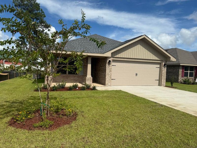 Front exterior of a new home in Ridgeway Landing, Crestview, FL, highlighting curb appeal (Image 1).