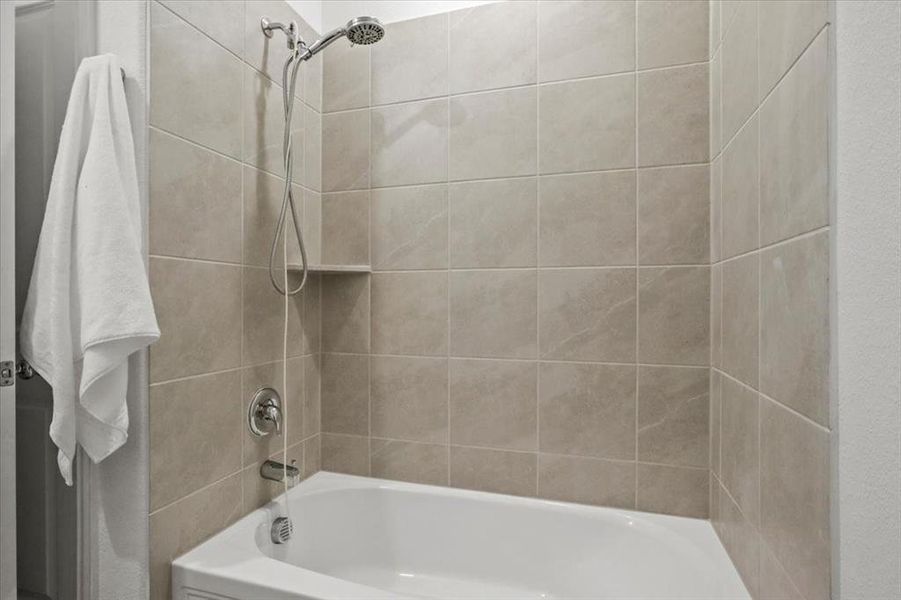 Bathroom featuring shower combination Bathroom featuring shower combination