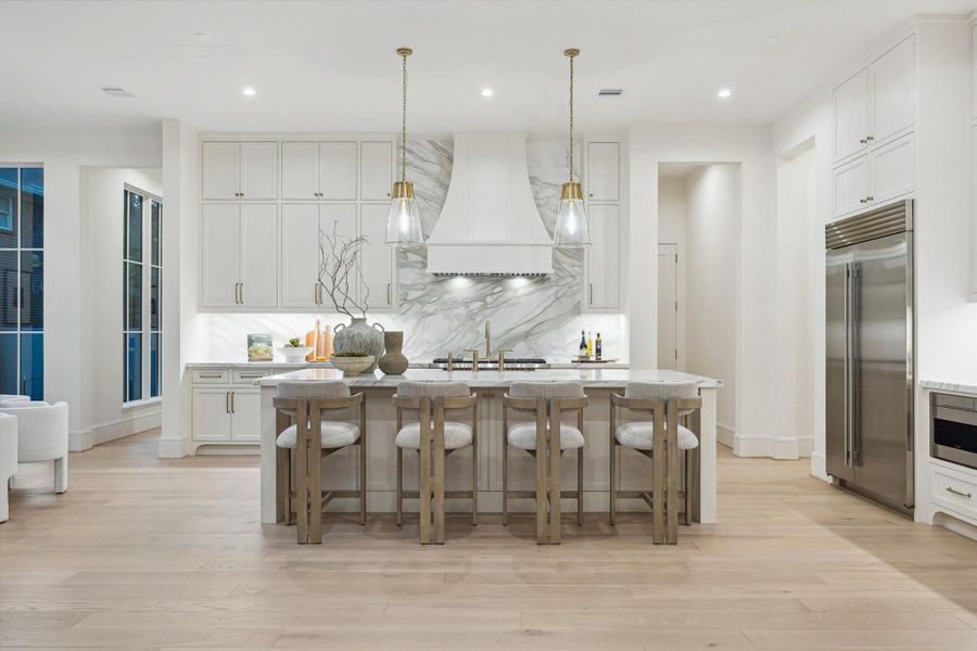 At the home’s heart is a stunning chef’s kitchen that marries form and function. At the home’s heart is a stunning chef’s kitchen that marries form and function.