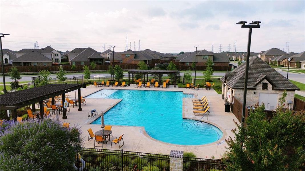 Community pool featuring a residential view and a patio Community pool featuring a residential view and a patio