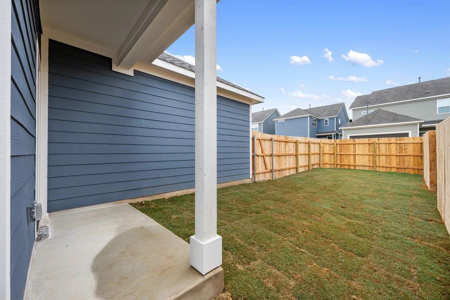 Exterior details and patio area of a home in The Cottages at Lariat, Liberty Hill (Image 27).