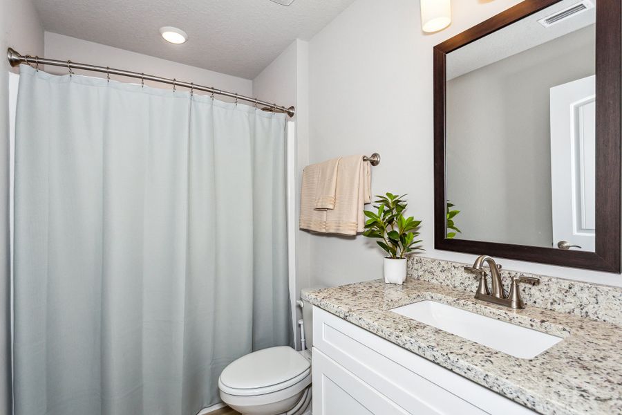 Representative furnished interior of a home built from the The Sapphire by Herbst Homes in Clear Water Landing, Milton (Image 52).