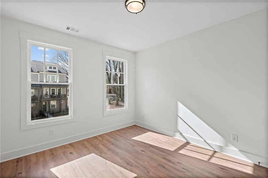 Spacious, unfurnished interior of a new home in Devin's Shire - A Kennesaw Tradition, Kennesaw (Image 18).