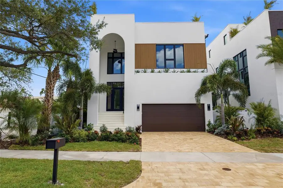 Front exterior of a new home in , Tampa, FL, highlighting curb appeal (Image 1). Front exterior of a new home in , Tampa, FL, highlighting curb appeal (Image 1).