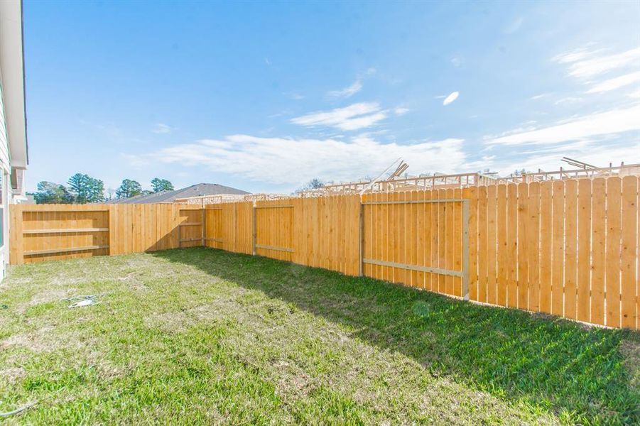 Wide-open and inviting, this fully fenced backyard is a perfect mix of privacy and functionality. From gardening to playtime, the possibilities are endless. Enjoy serene outdoor living right outside your back door.