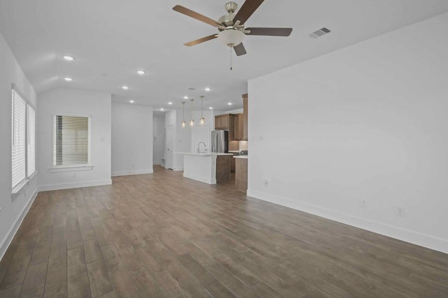 Representative unfurnished interior of a home built from the Carriagehouse by Chesmar Homes in Meridiana Townhomes, Iowa Colony (Image 84).