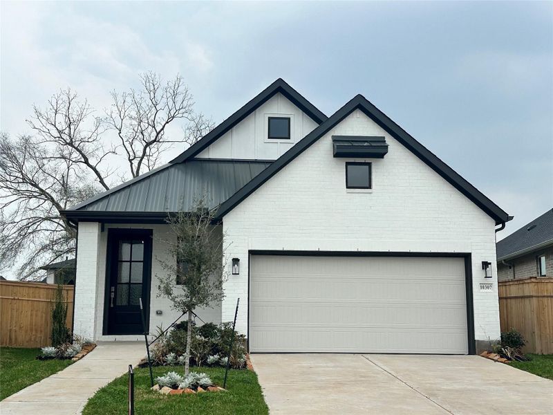 Front exterior of a new home in Sienna, Missouri City, TX, highlighting curb appeal (Image 2).