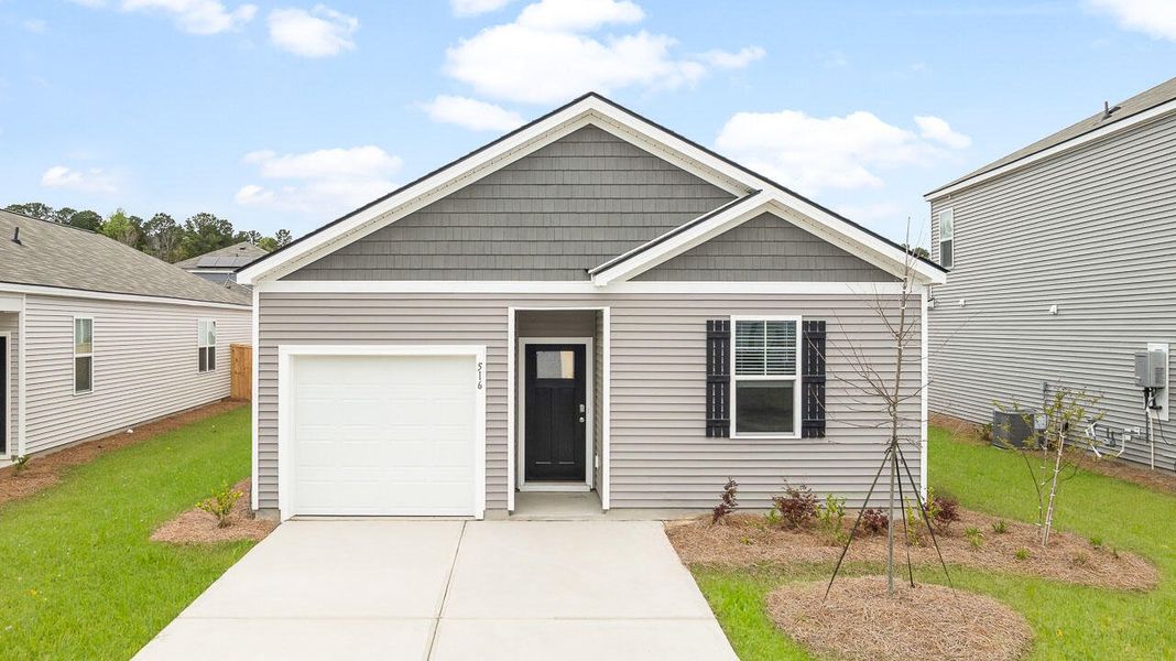 Front exterior of a new home in Pine Hills at Cane Bay, Summerville, SC, highlighting curb appeal (Image 1). Front exterior of a new home in Pine Hills at Cane Bay, Summerville, SC, highlighting curb appeal (Image 1).