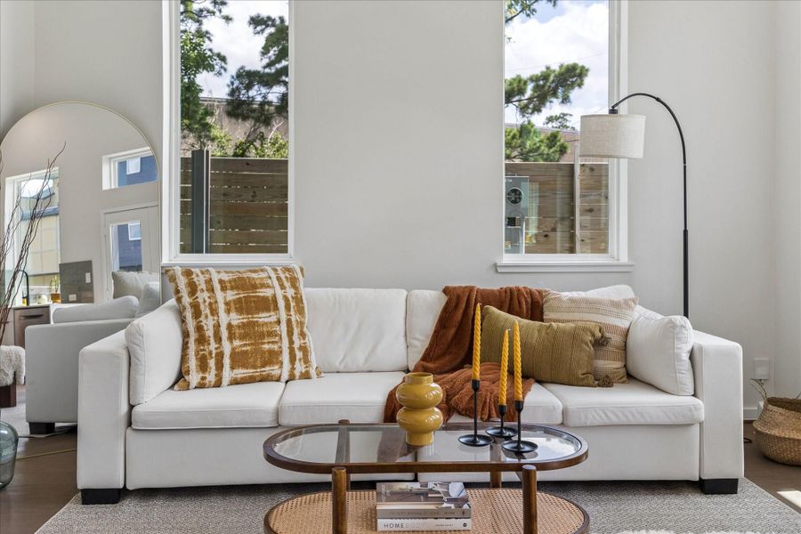 Designer appointed living room vignette showcasing curated finishes, abundant natural light, and contemporary comfort. Designer appointed living room vignette showcasing curated finishes, abundant natural light, and contemporary comfort.