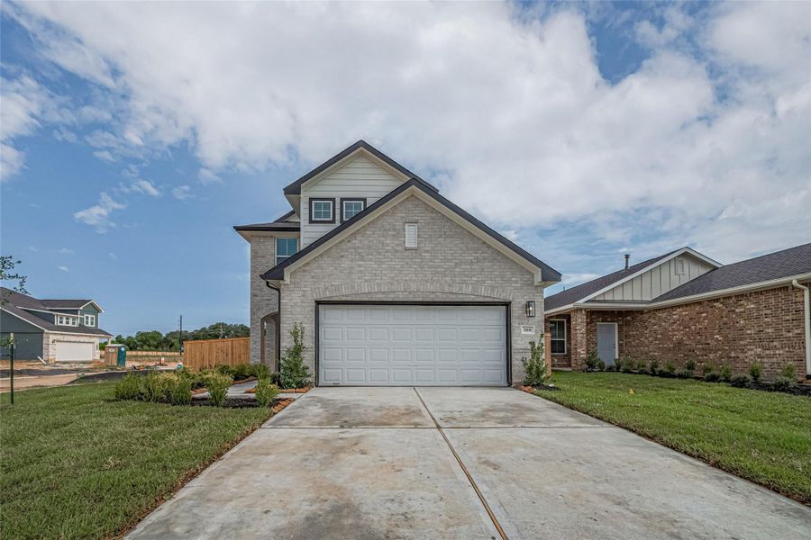 Front exterior of a new home in La Segarra, Brookshire, TX, highlighting curb appeal (Image 26).