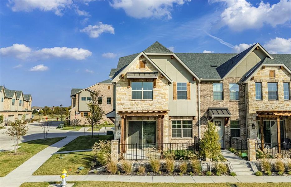 Craftsman inspired home with a residential view, stone siding, roof with shingles, and stucco siding