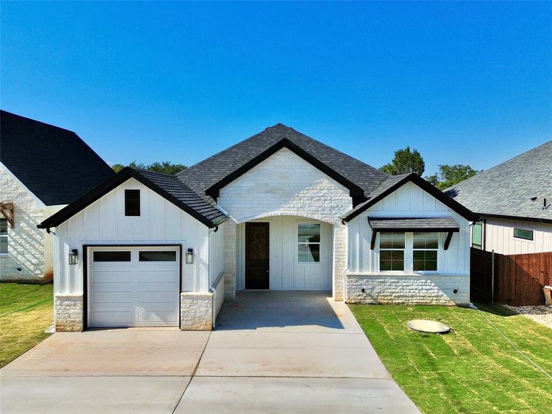 Front exterior of a new home in , Granbury, TX, highlighting curb appeal (Image 1). Front exterior of a new home in , Granbury, TX, highlighting curb appeal (Image 1).