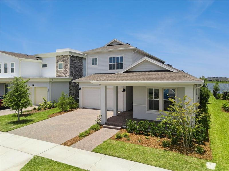 Front exterior of a new home in Laureate Park, Orlando, FL, highlighting curb appeal (Image 26).