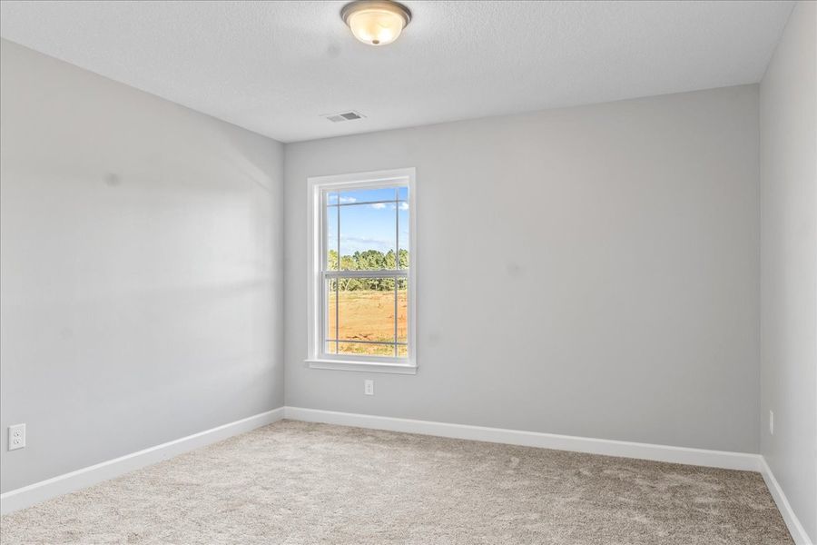 Representative unfurnished interior of a home built from the Whitney by Enchanted Homes in Lonesome Dove, San Antonio (Image 27).