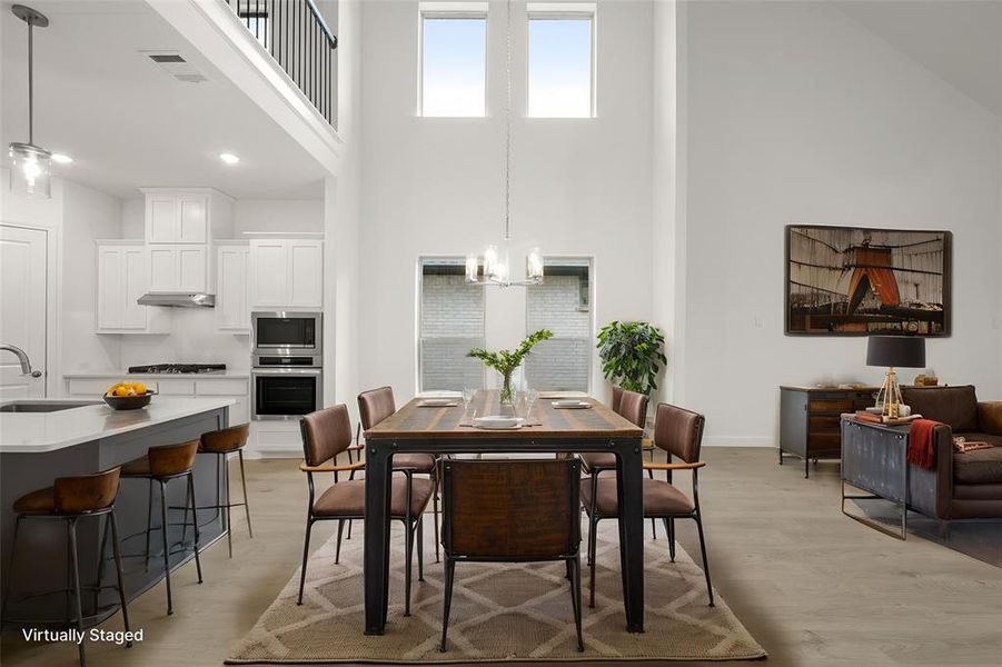 This floorplan is perfect for entertaining. From the open design to the plank floors, it has a fantastic flow. The wall of windows stream natual light.