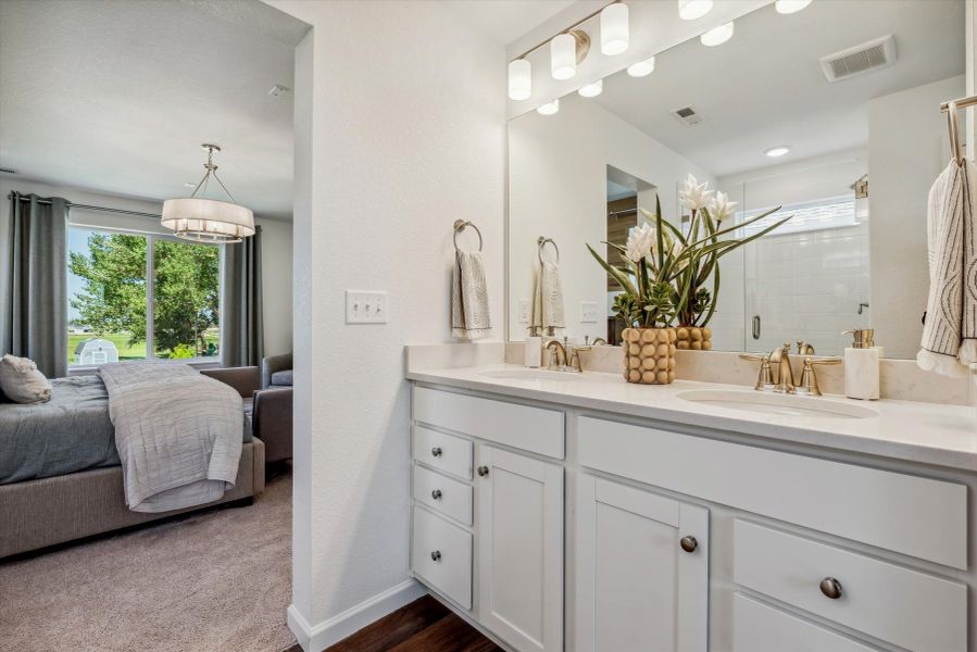 A bathroom with a large mirror. A bathroom with a large mirror.