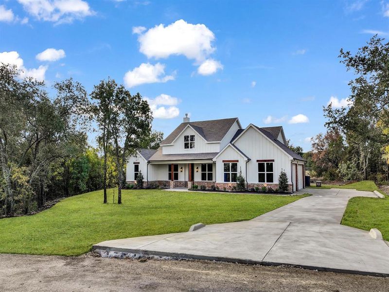 Front exterior of a new home in , Weatherford, TX, highlighting curb appeal (Image 2).