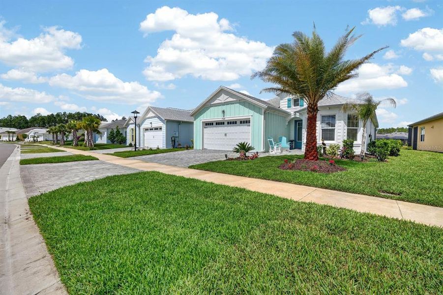 Front exterior of a new home in , Daytona Beach, FL, highlighting curb appeal (Image 28).
