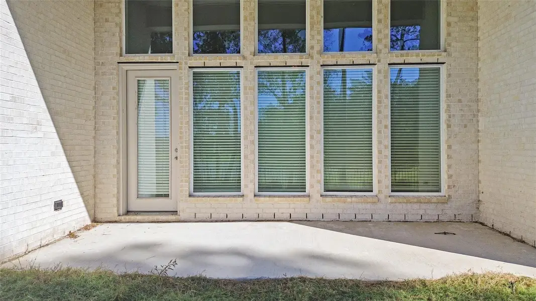 Exterior details and patio area of a home in Audubon Park 70', Magnolia (Image 2).