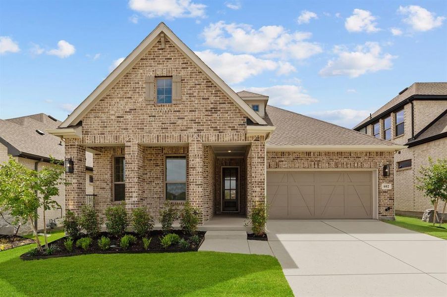 Front exterior of a new home in South Pointe  Cottage Series, Mansfield, TX, highlighting curb appeal (Image 18).