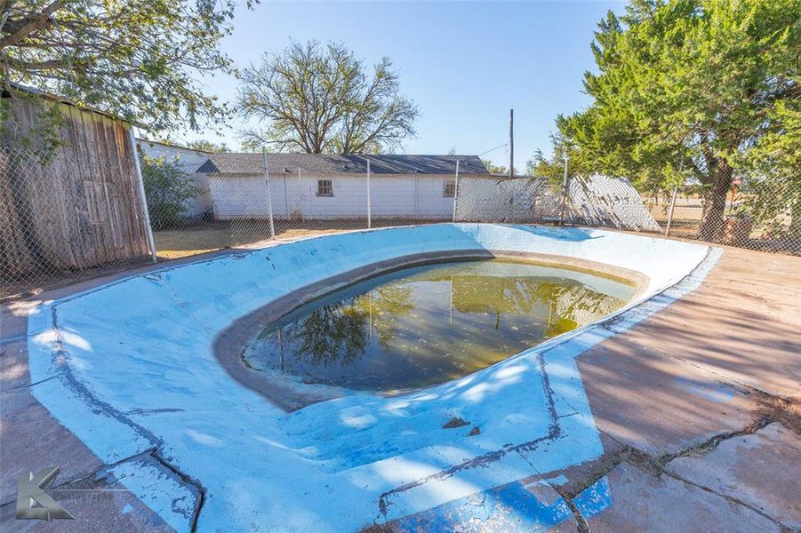 View of swimming pool with a fenced backyard View of swimming pool with a fenced backyard