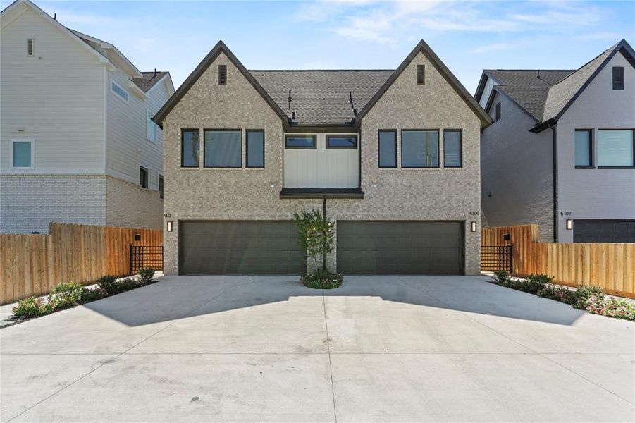 View of front of property with brick siding, concrete driveway, and a garage View of front of property with brick siding, concrete driveway, and a garage