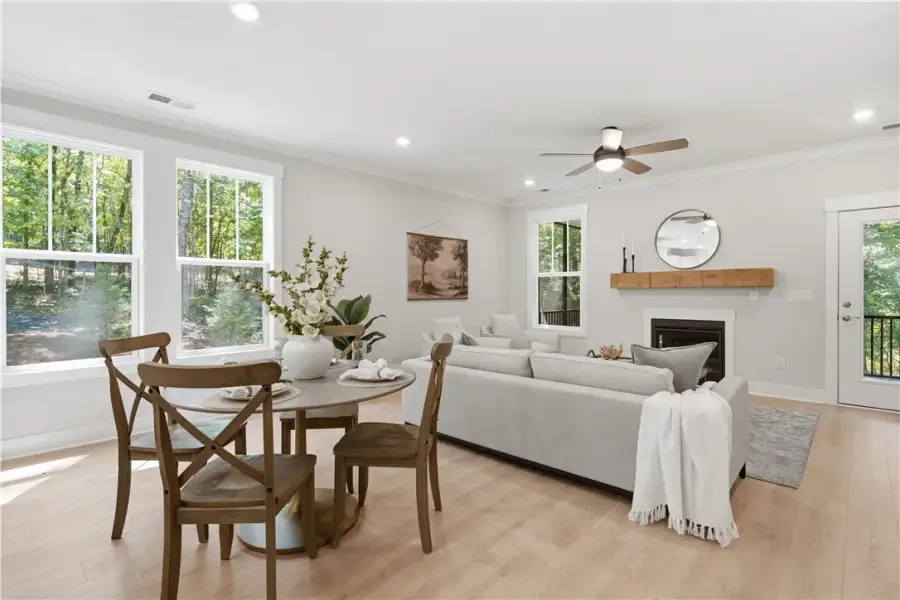 Hardwood floors and a cozy fireplace anchor this i