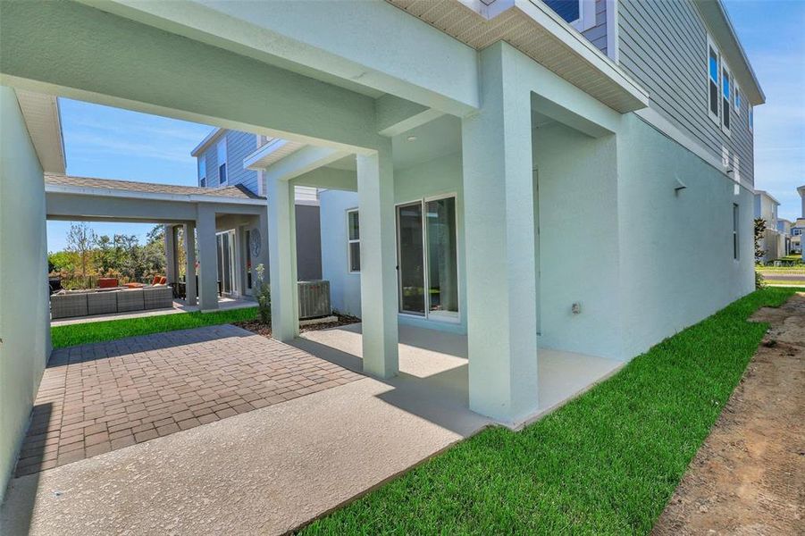 Exterior details and patio area of a home in Serenade at Ovation, Winter Garden (Image 4).