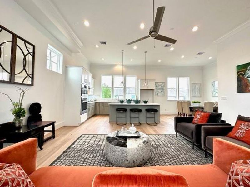 The 12' ceilings and windows bring so much open space and natural light!Photo: model home of similar plan.