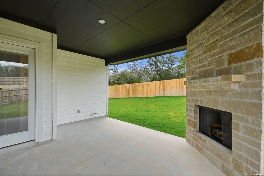 Exterior details and patio area of a home in The Reserve at Potranco Oaks, Castroville (Image 32).