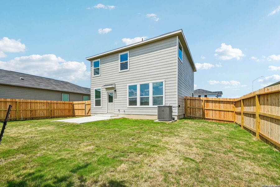Exterior details and patio area of a home in Woodside Farms, Seguin (Image 4).