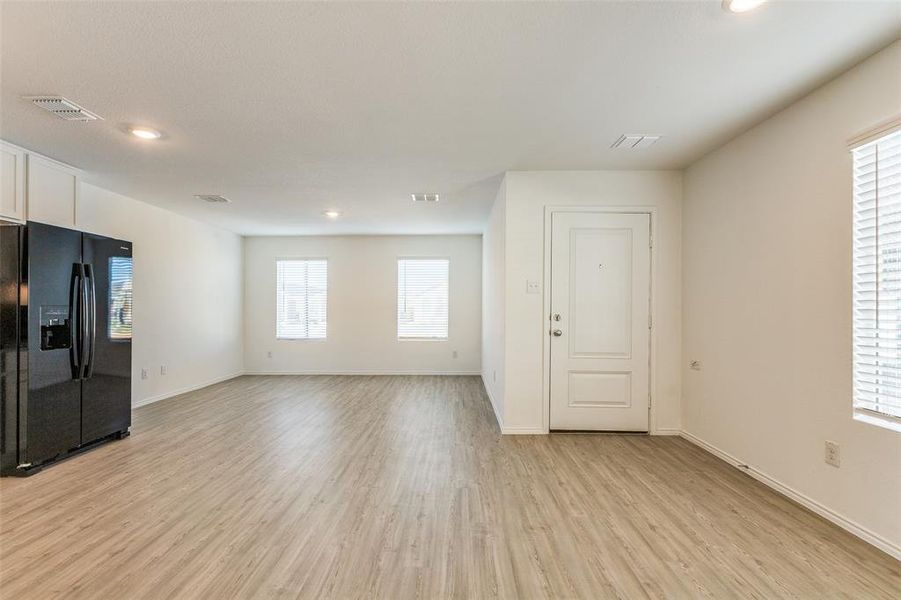 Unfurnished living room featuring light hardwood / wood-style flooring