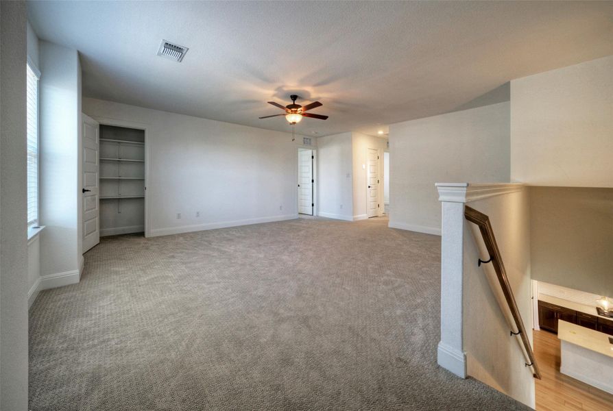 Soft carpeting underfoot defines this versatile upper-level landing overlooking the main floor entryway. Soft carpeting underfoot defines this versatile upper-level landing overlooking the main floor entryway.