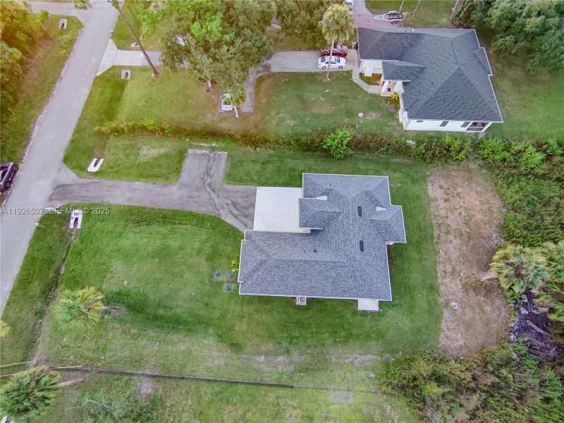 Front exterior of a new home in , Naples, FL, highlighting curb appeal (Image 30). Front exterior of a new home in , Naples, FL, highlighting curb appeal (Image 30).