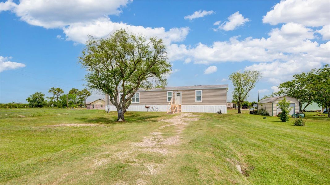 Exterior details and patio area of a home in , Brazoria (Image 23).